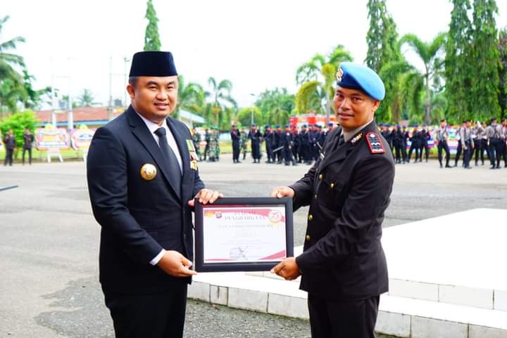 Polres Dharmasraya Gelar Upacara HUT Bhayangkara ke 78, Sutan Riska Ucapkan Selamat 